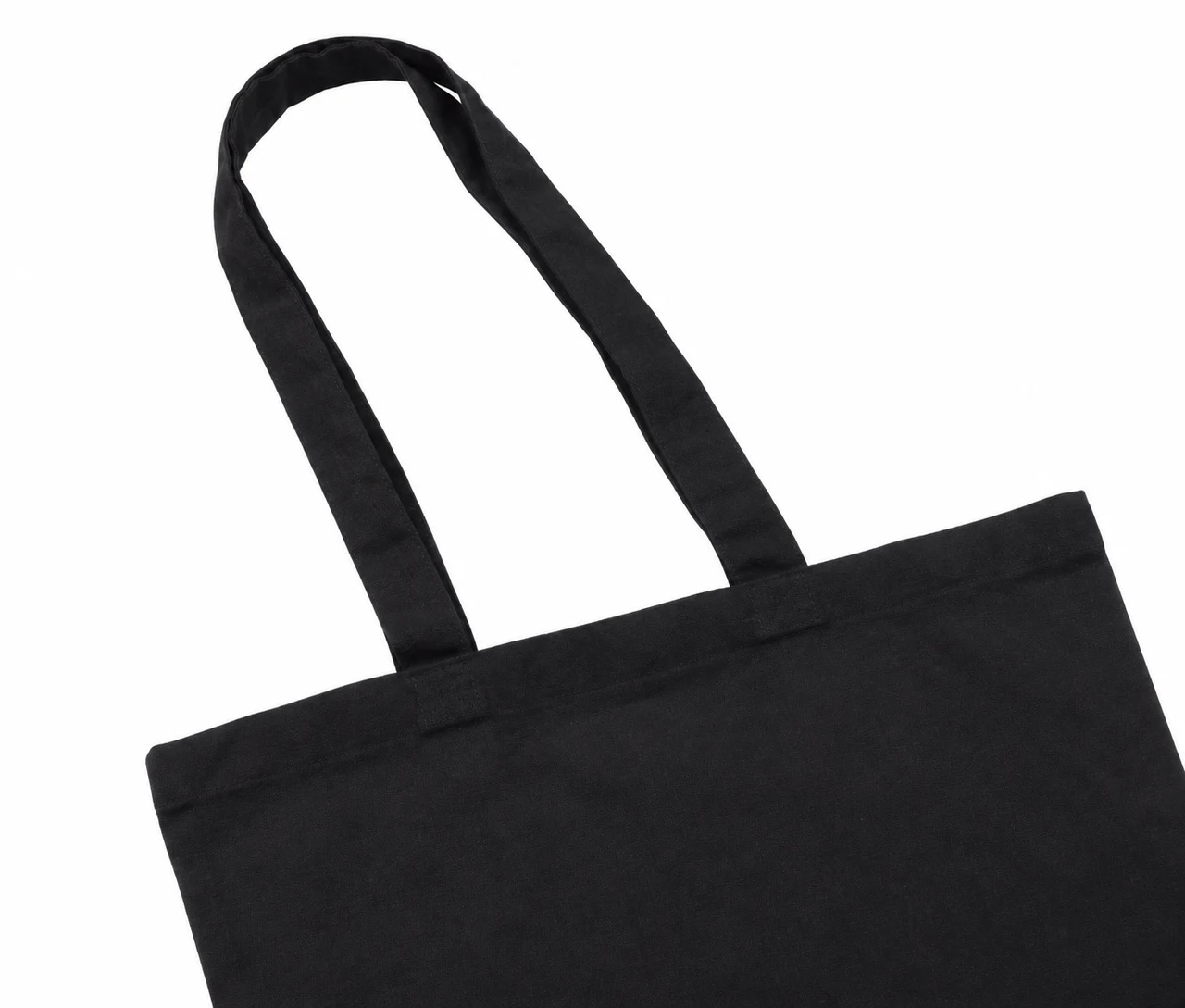 Økologisk bomuldspose, 30 × 35 cm, nærbillede af hankene og syningerne – sort